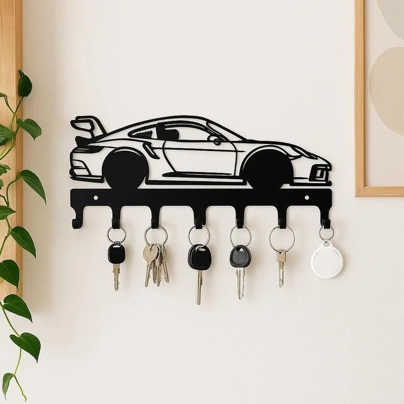 A 3D-printed Porsche 911 wall piece used as a key holder.